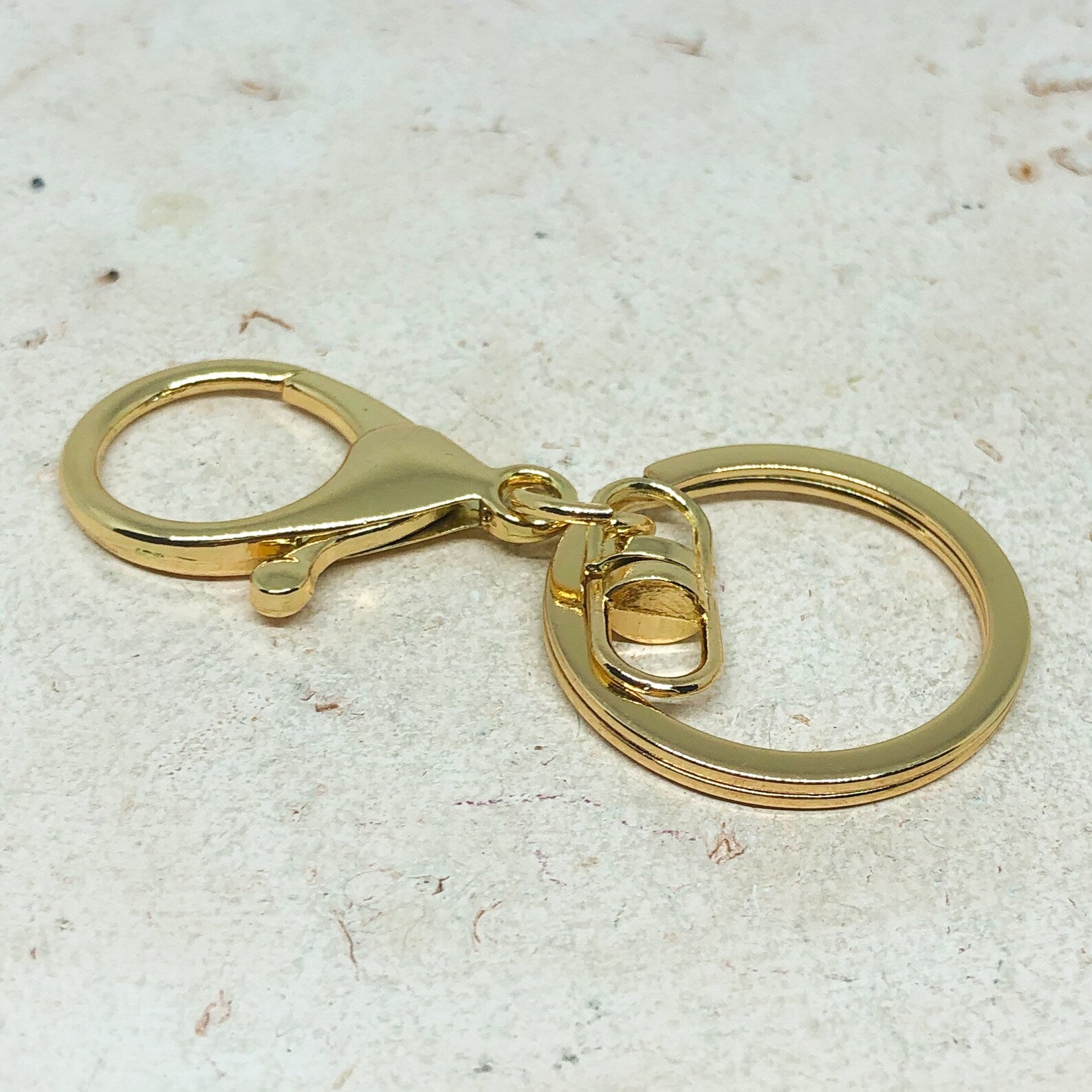 Schlüsselanhänger mit Karabinerverschluss Goldfarben