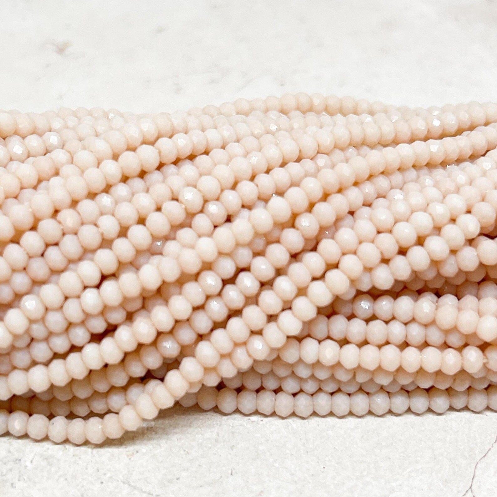 Glasschliffperlen 2mm Beige