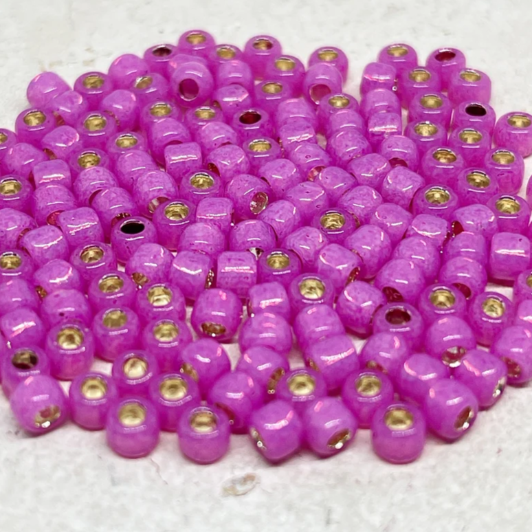 TOHO Perlen Rocaille 6/0 4mm 10g Milky Hot Pink