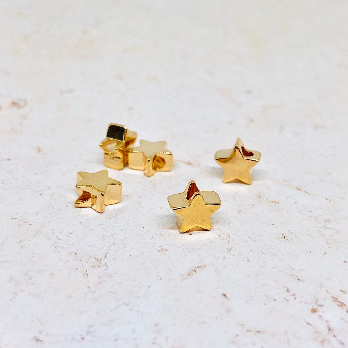 Messing Perle Stern vergoldet 10 St.