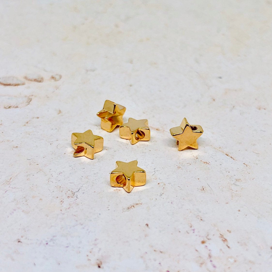 Messing Perle Stern vergoldet 10 St.