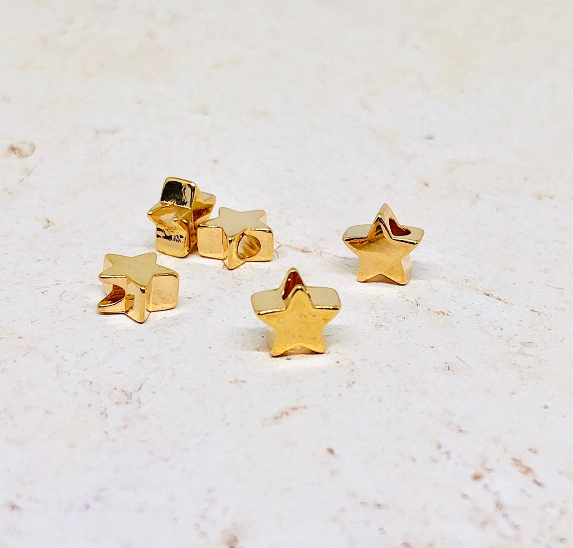 Messing Perle Stern vergoldet 10 St.