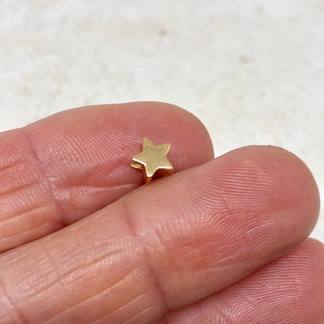 Messing Perle Stern vergoldet 10 St.