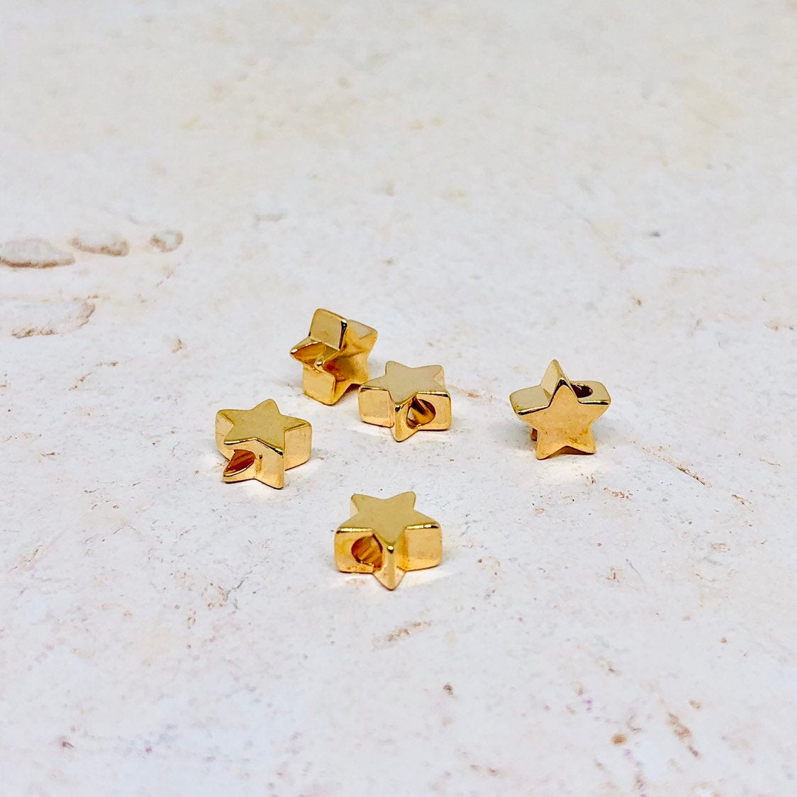 Messing Perle Stern vergoldet 10 St.