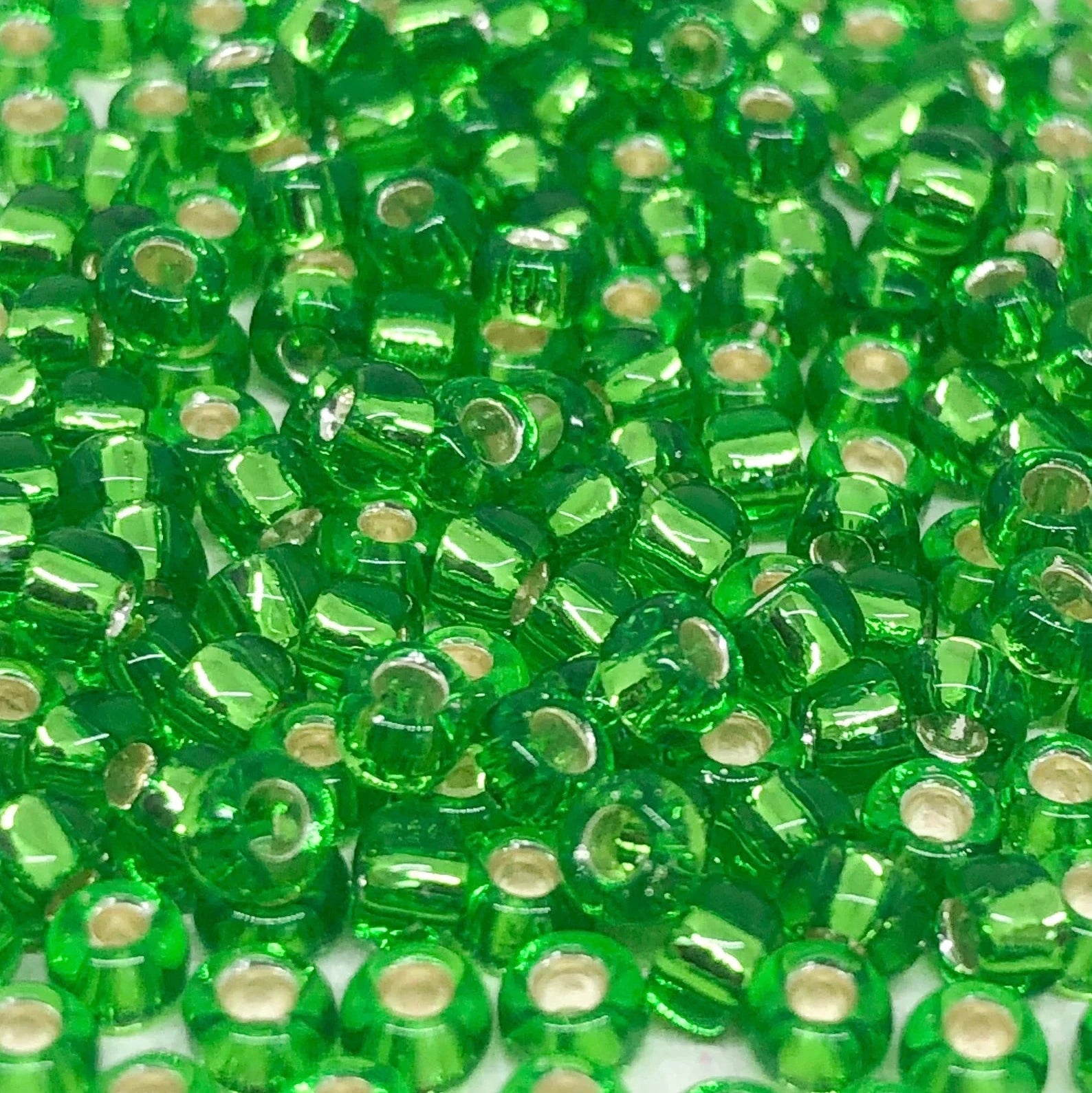 TOHO Beads Perlen Rocaille 10g Nr. 27 Silver Linend Peridot