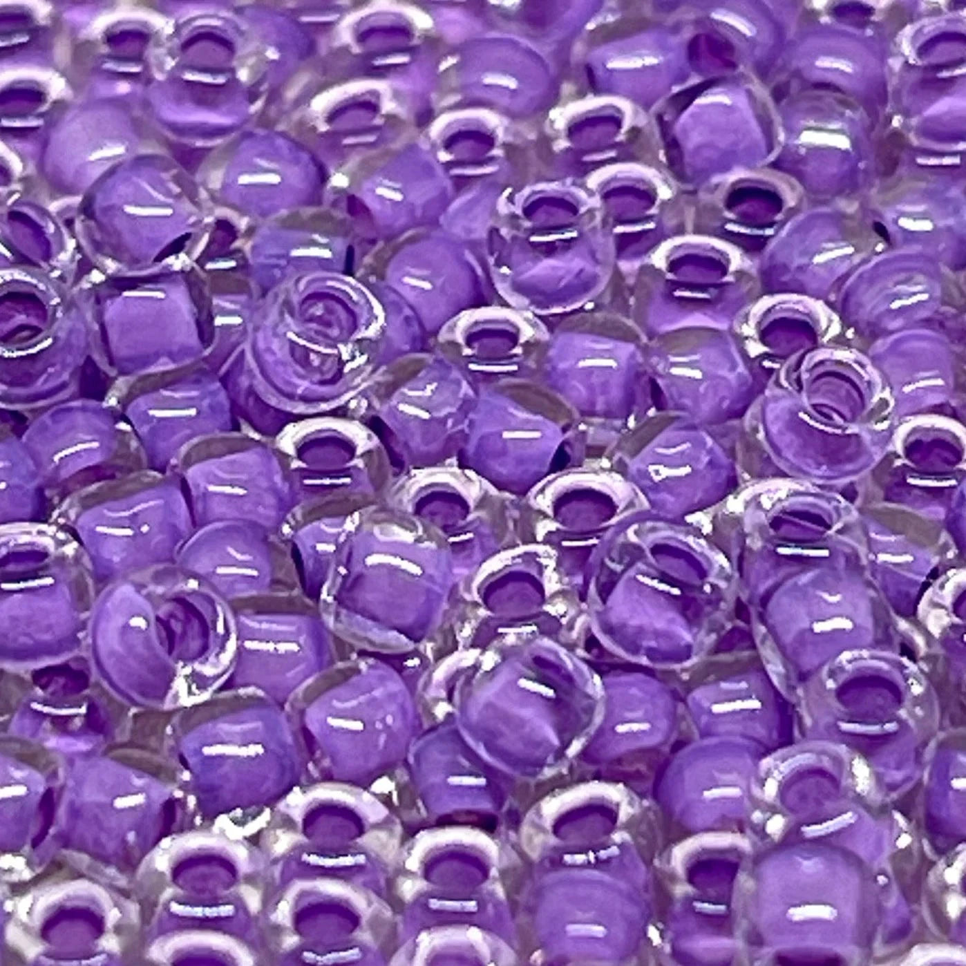 TOHO Beads Perlen Rocaille 10g Nr. 935 Inside Color Crystal/Wisteria-Lined