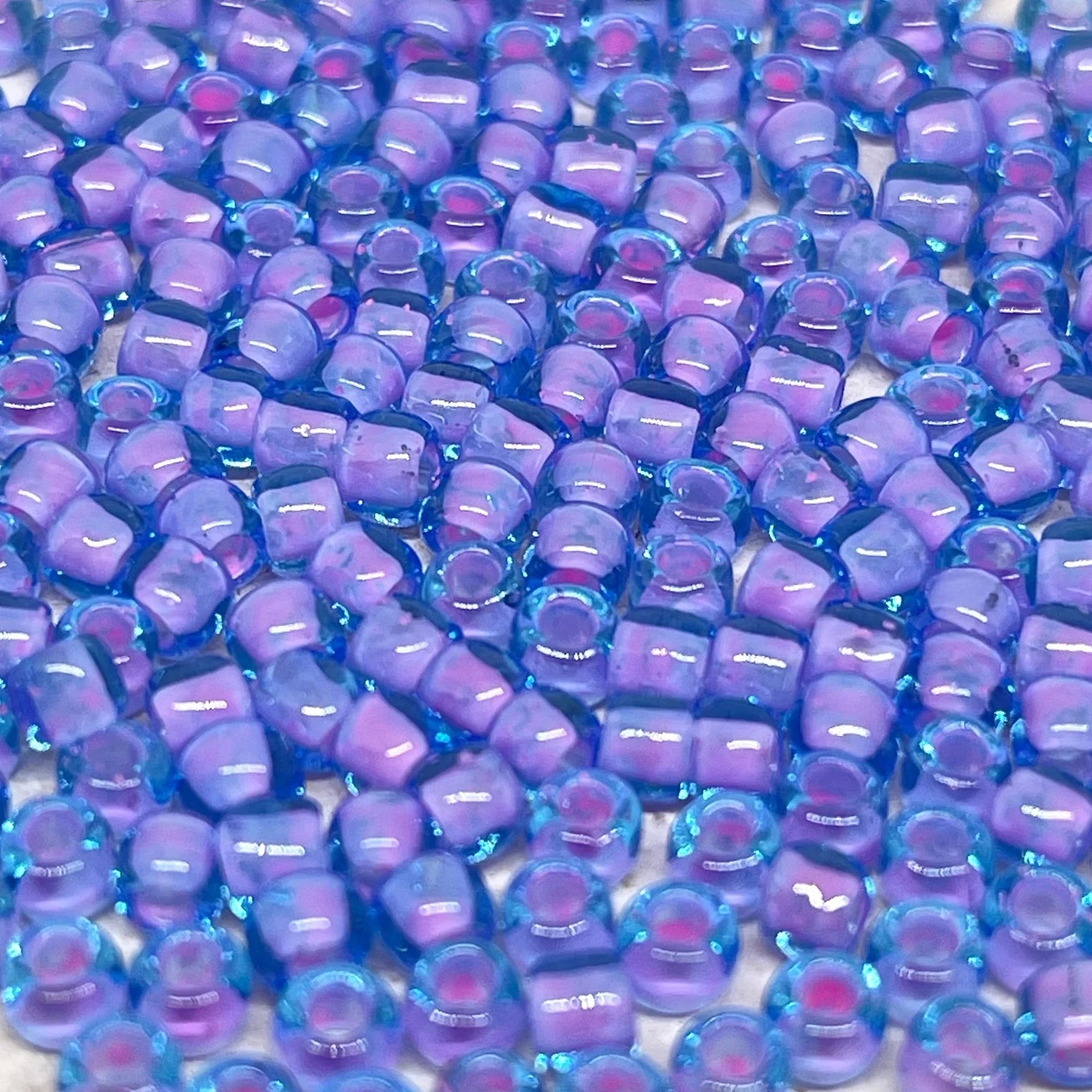 TOHO Beads Perlen Rocaille 10g Nr. 937 Inside-Color Aqua/Bubble Gum Pink Linend
