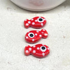Porzellan Fisch Perle Rot mit weißen Punkten.