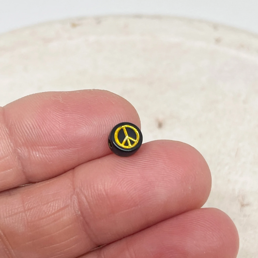 50 St. runde Perlen mit Peace Zeichen Friedenszeichen 7mm - Schwarz Gold