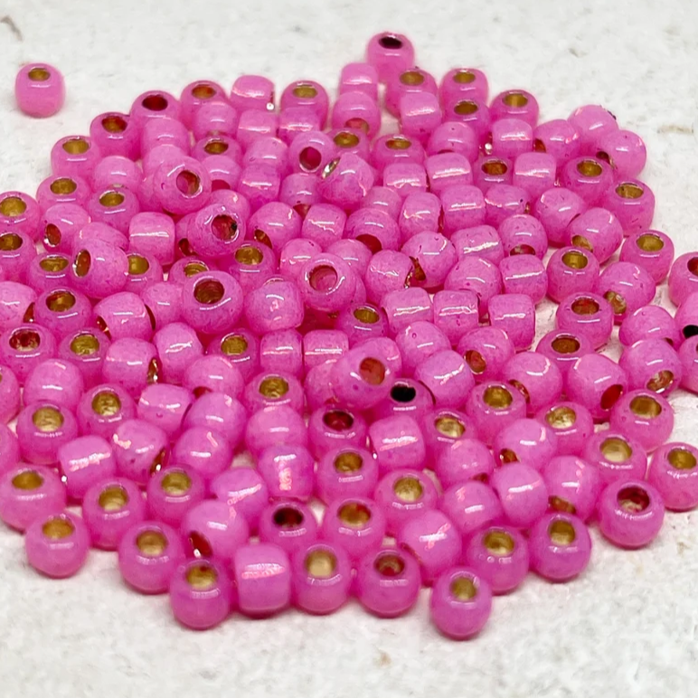 TOHO Perlen Rocaille 6/0 4mm 10g Milky Hot Pink